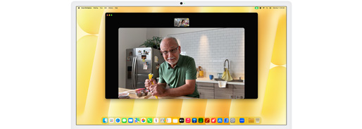 Desk View demonstration. Person on a video call while decorating cookies